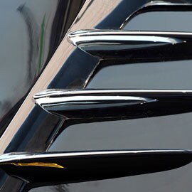 Decorative trim mounted on painted surface