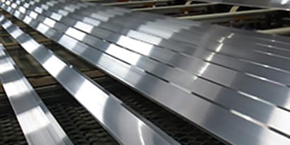 Strips of aluminum ready for metal adhesive
