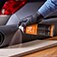 Learn about assembly applications. Image of spray adhesive being applied to a wood surface.
