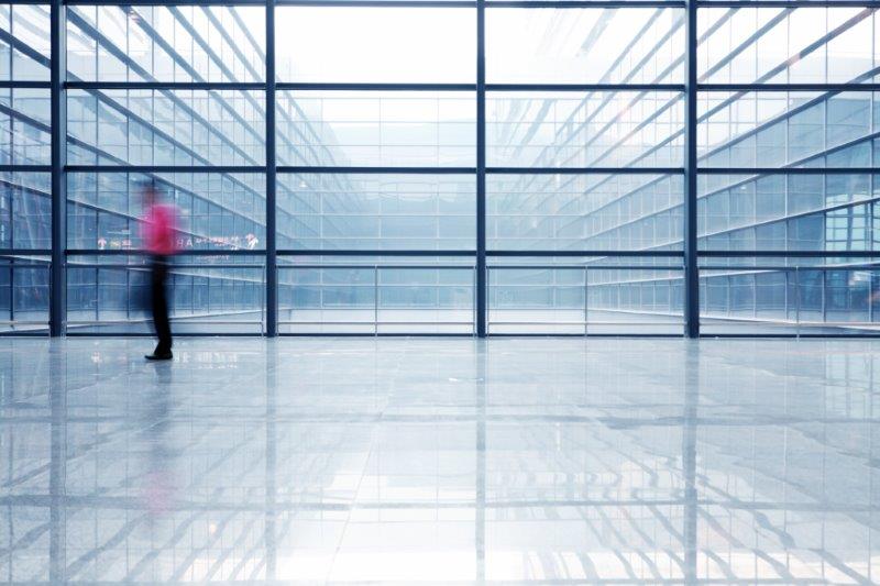 Behind an interior window covered with 3MTM Glass Finishes, we see the blurred shapes of a man and woman having a conversation.
