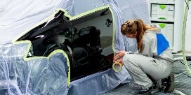 Technician masking a vehicle

