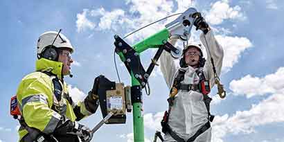 Workers setting up a Davit system
