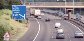 A  view over a motorway with a bit sign