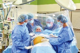 Surgical team prepare to make an incision on a c-section patient
