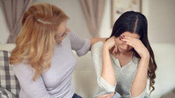 Image of anxious patient having a conversation with a family member
