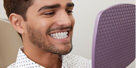 Man smiling with braces
